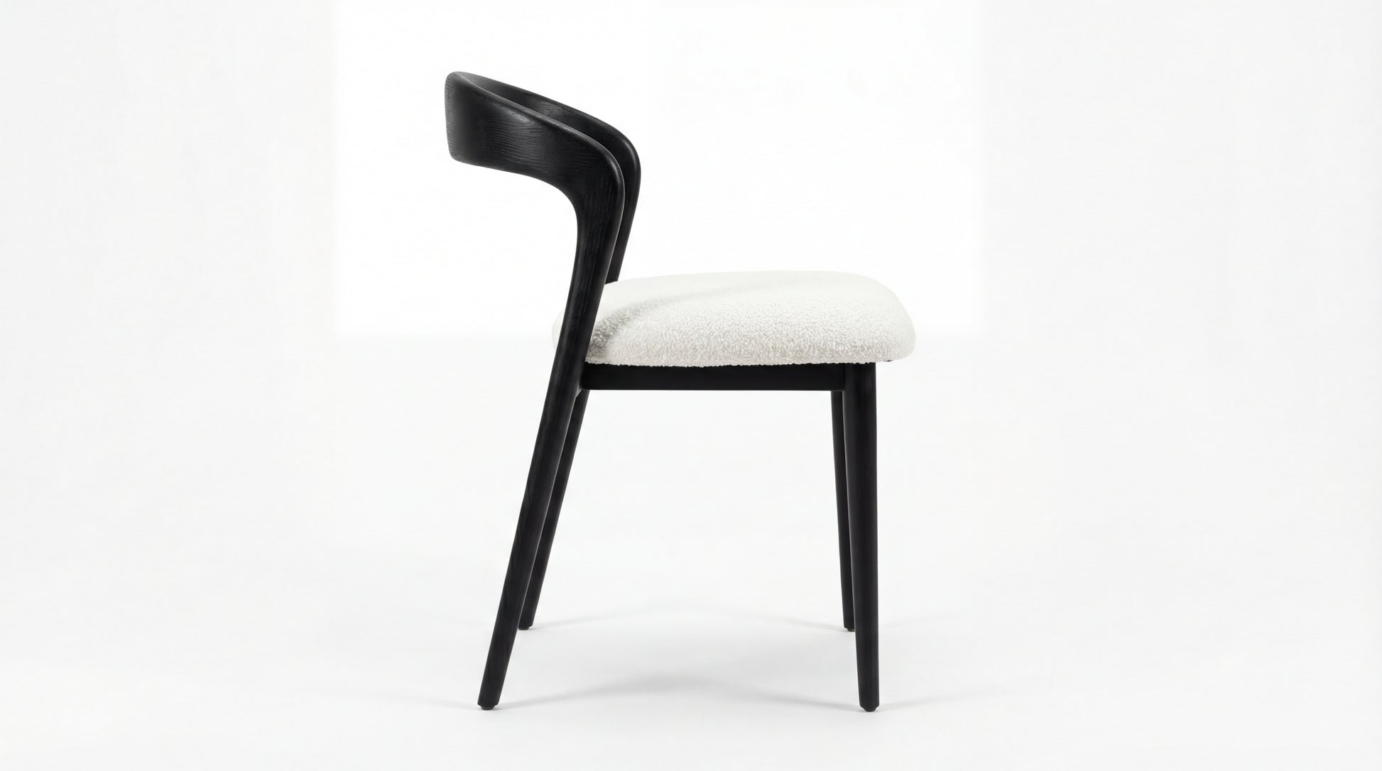 MARMO Dining Chair side view showing curved backrest and beech wood frame by NOAH Furniture