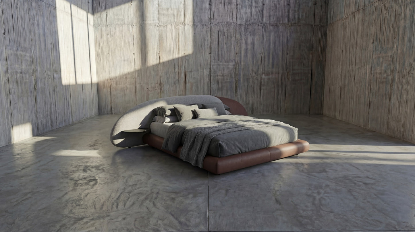 Modern bed with leather frame in a minimalistic room with wooden walls and concrete floor.