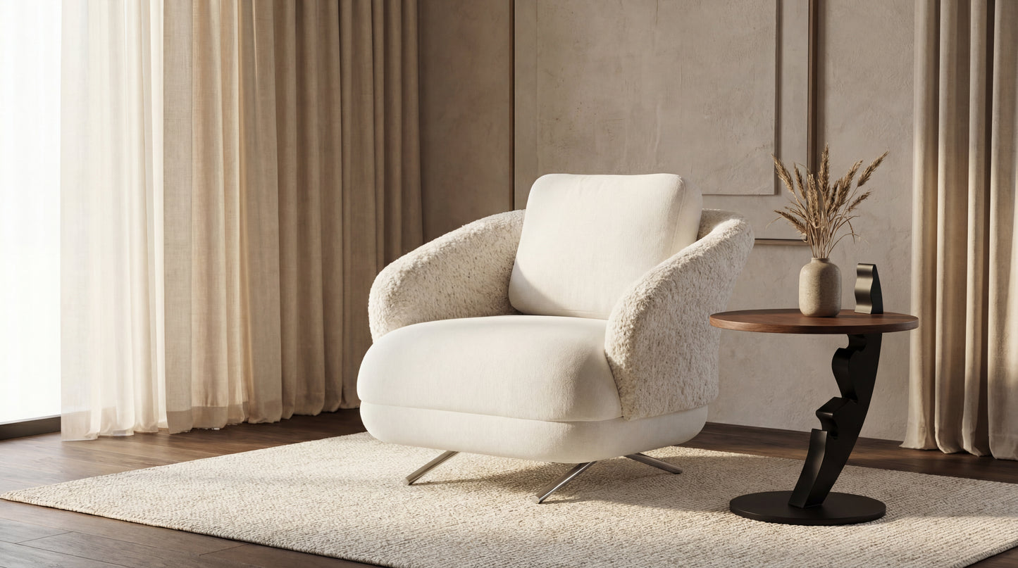 White armchair in a modern living room with a side table and decorative elements.